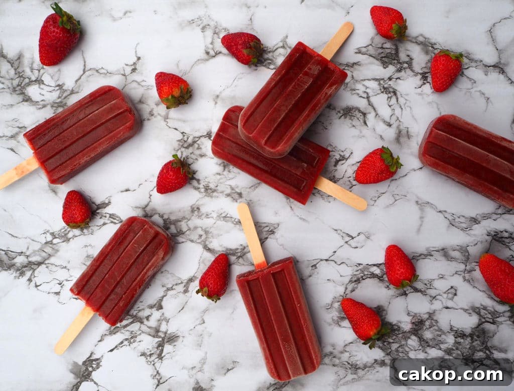 Strawberry balsamic black pepper popsicles with strawberries