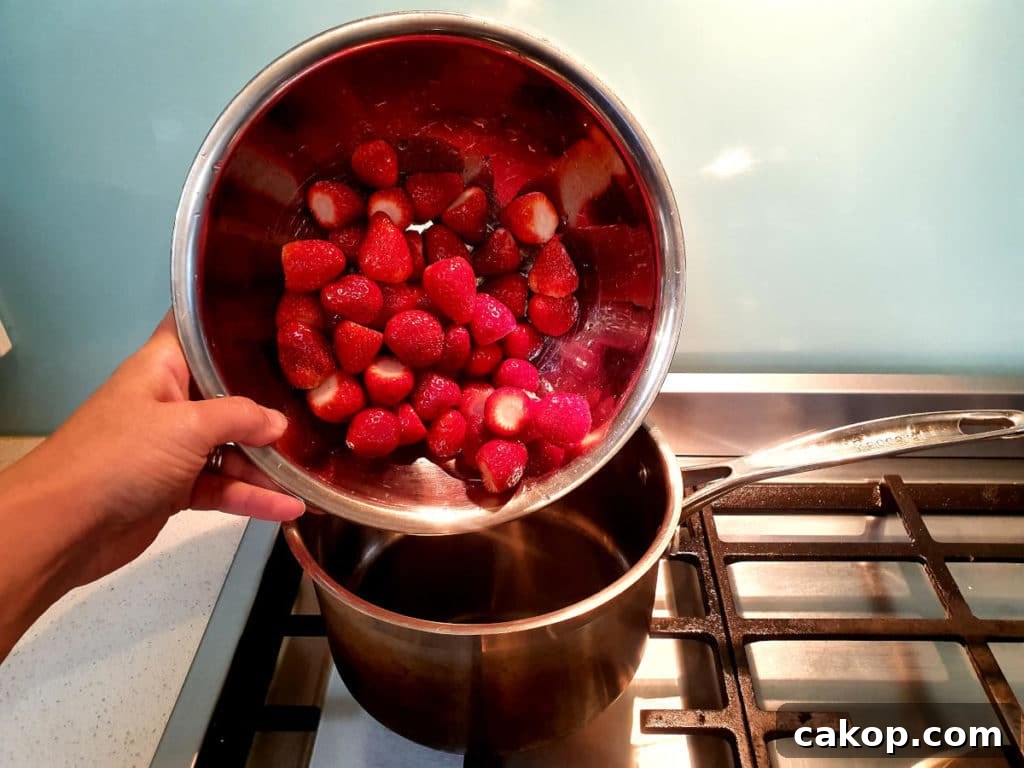 Adding strawberries to pot