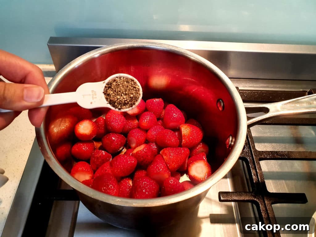 Adding black pepper to pot