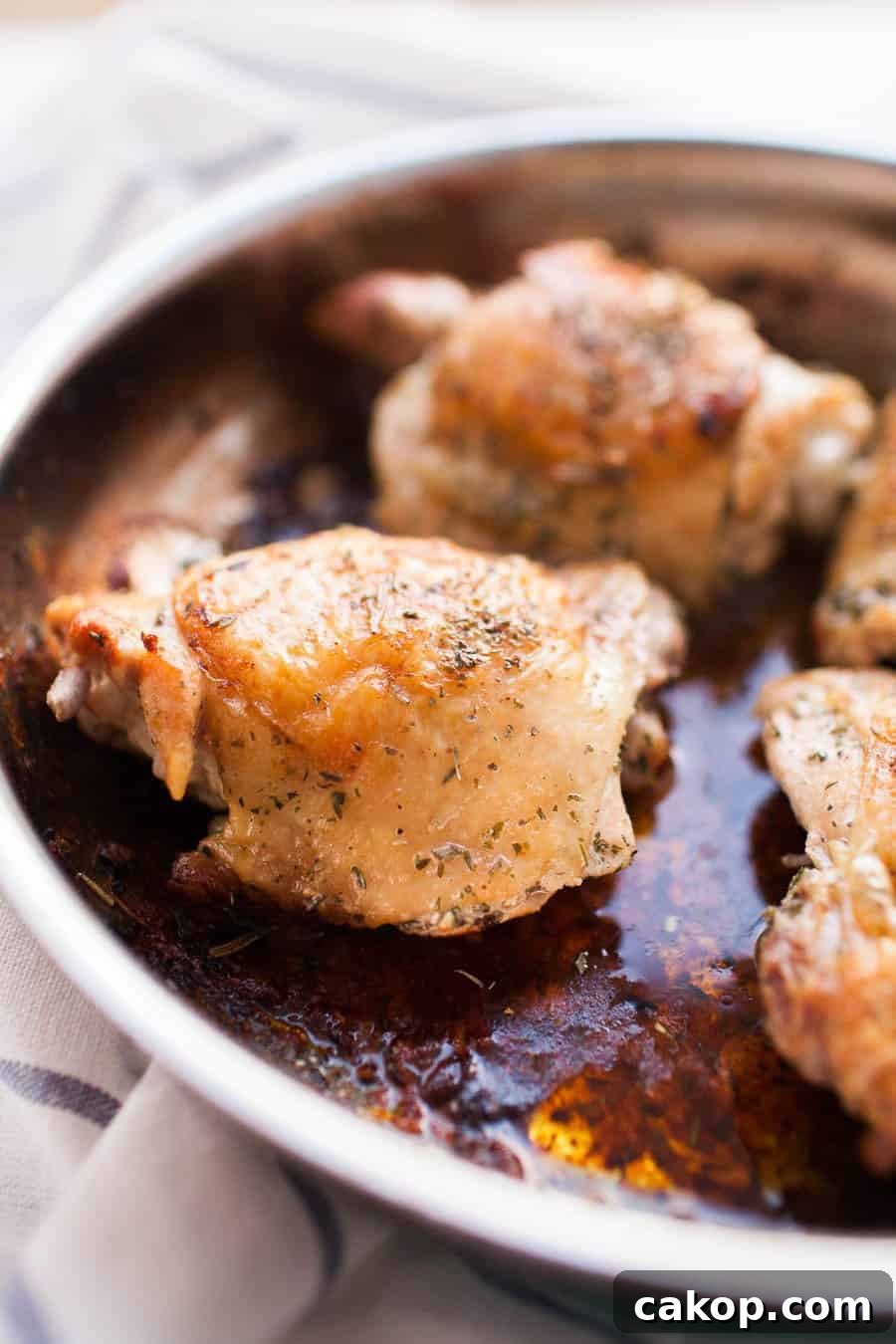 chicken thighs cooking in oil 