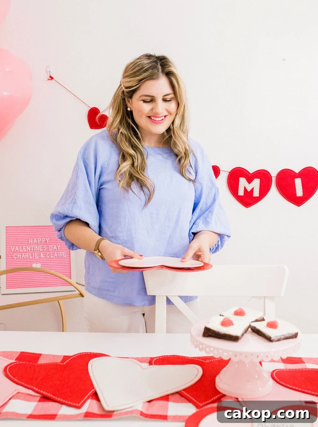 Valentine’s Party Ideas for Kids: Fun Games, Crafts & Treats 8 holding heart plates