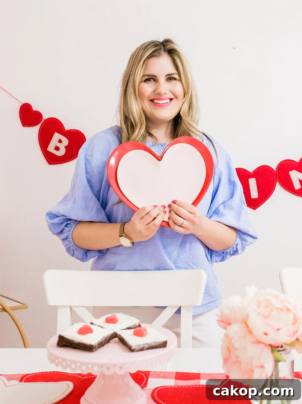 Valentine’s Party Ideas for Kids: Fun Games, Crafts & Treats 10 holding heart plates