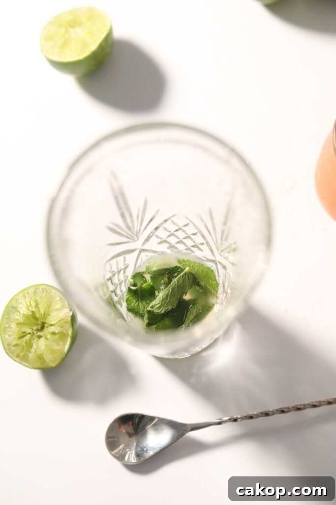 fresh mint leaves in a cocktail shaker.