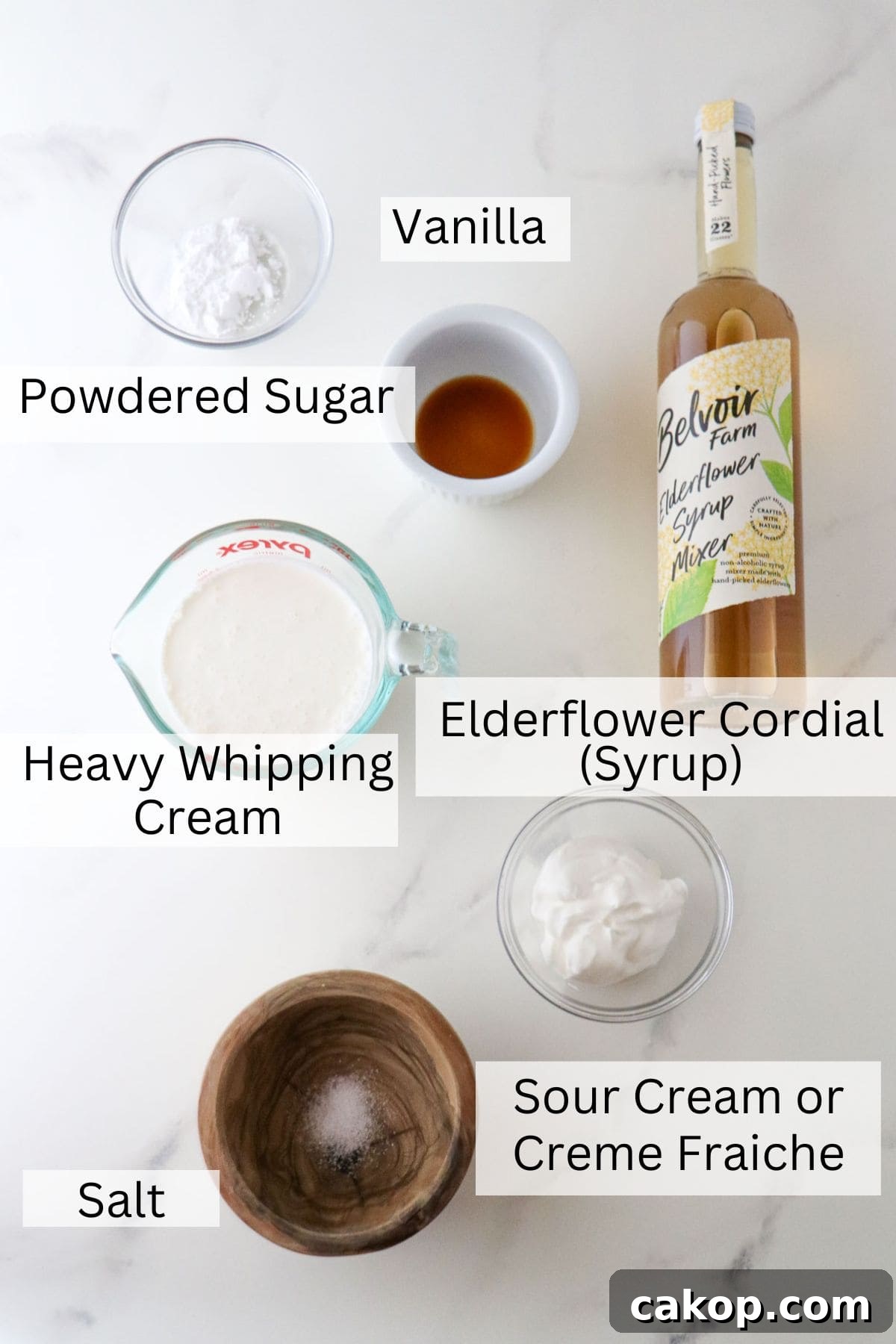 Light Scandinavian Elderflower Cream Dessert for Summer 3 Labeled ingredients for Elderflower Cream.