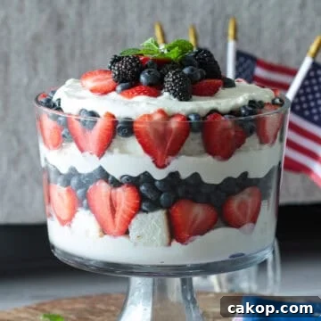 Red white blue layered cake trifle with cream cheese and whipped cream filling.