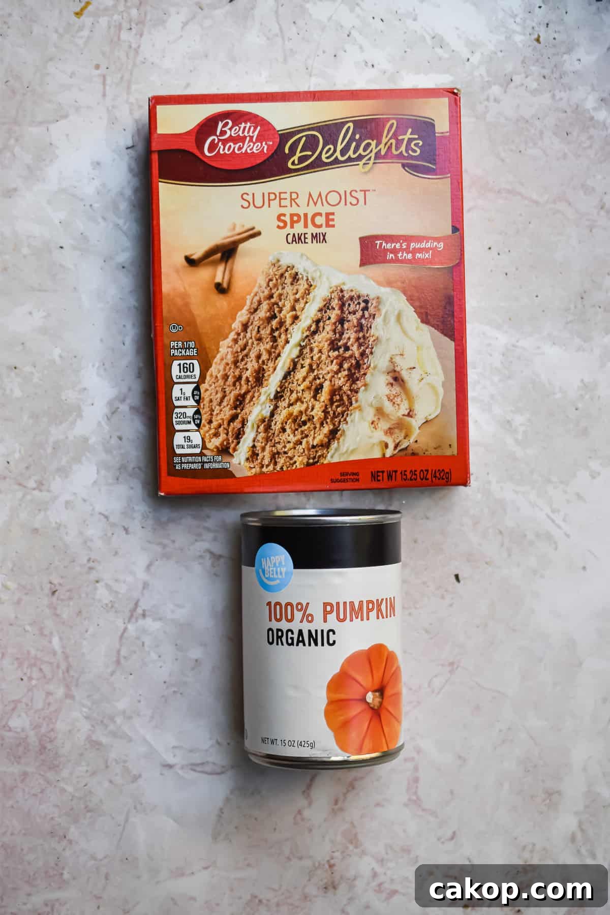 2-Ingredient Pumpkin Spice Muffins — Quick Autumn Recipe 3 An overhead shot of the ingredients for 2 ingredient pumpkin muffins.