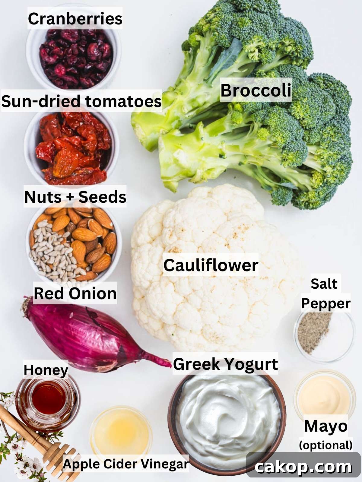 Ingredients for healthy broccoli cauliflower salad with Greek yogurt dressing arranged on table.