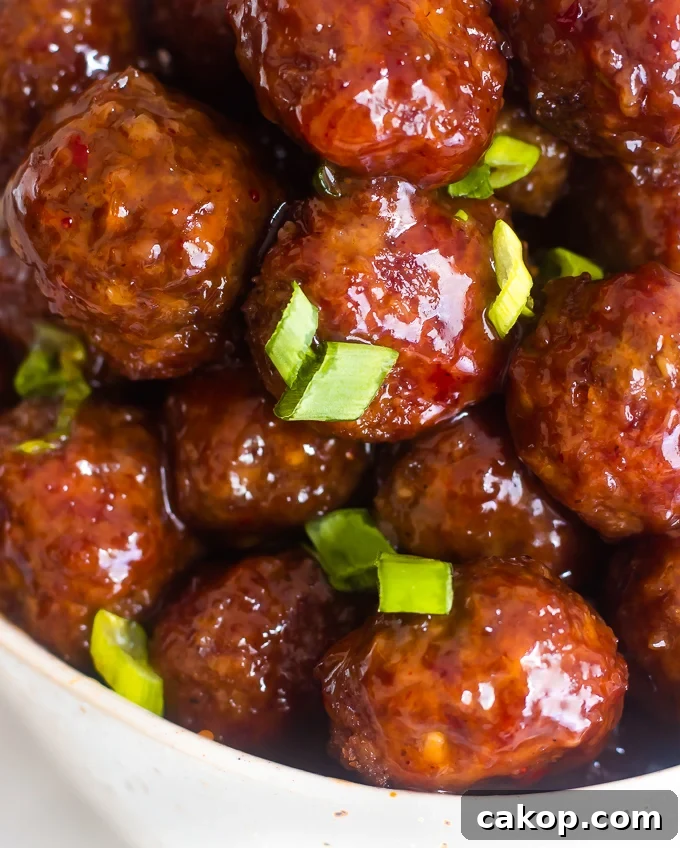 A closeup of a bowl of jelly meatballs