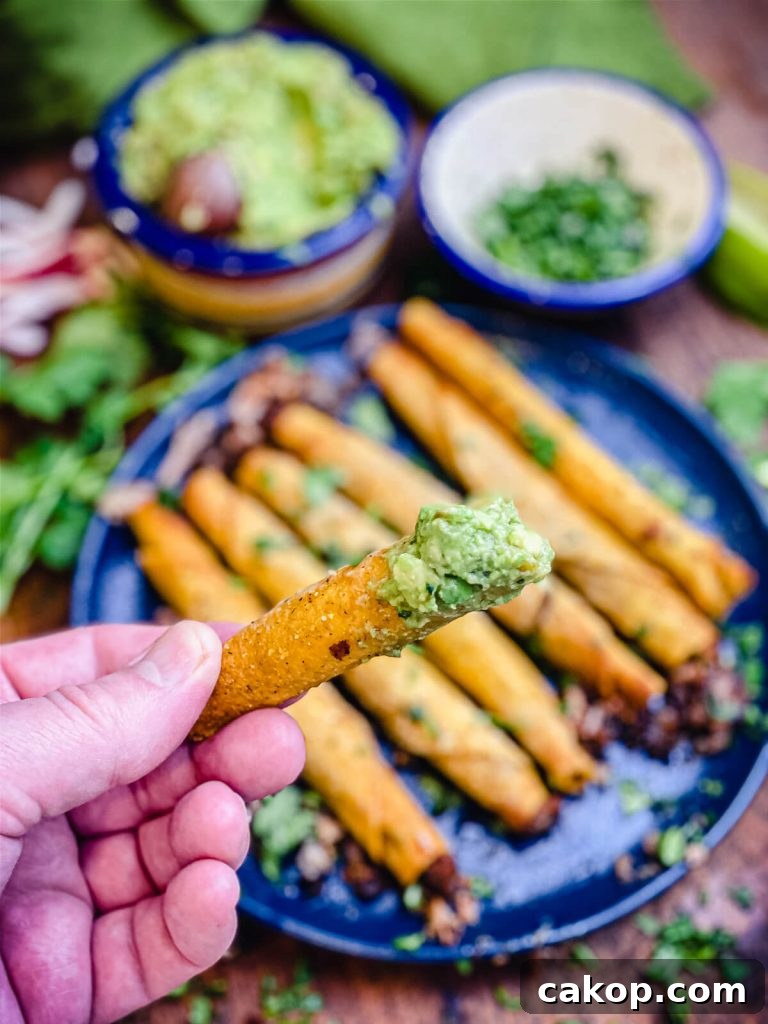 taquito dipped in guacamole