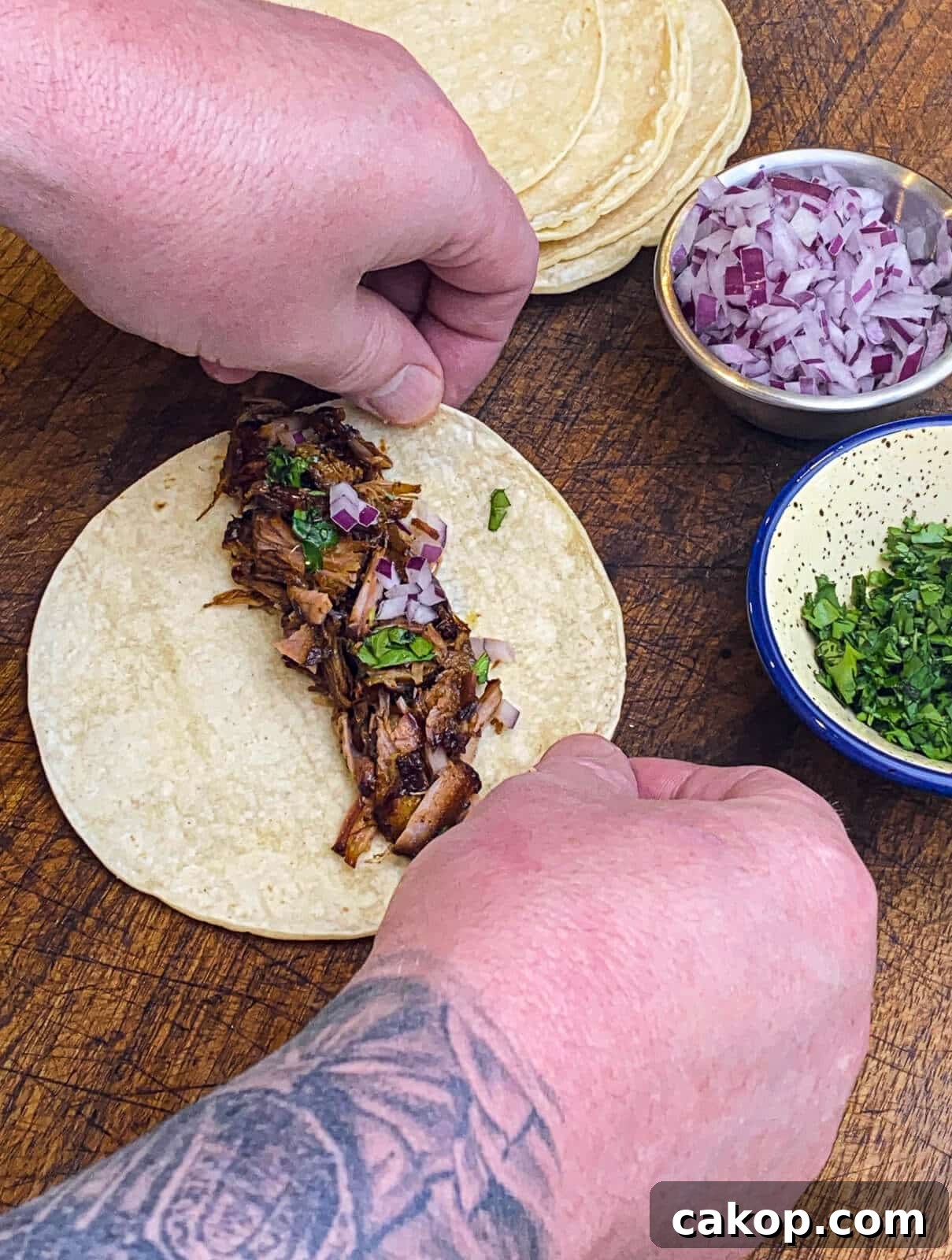 assembling taquitos on a cutting board