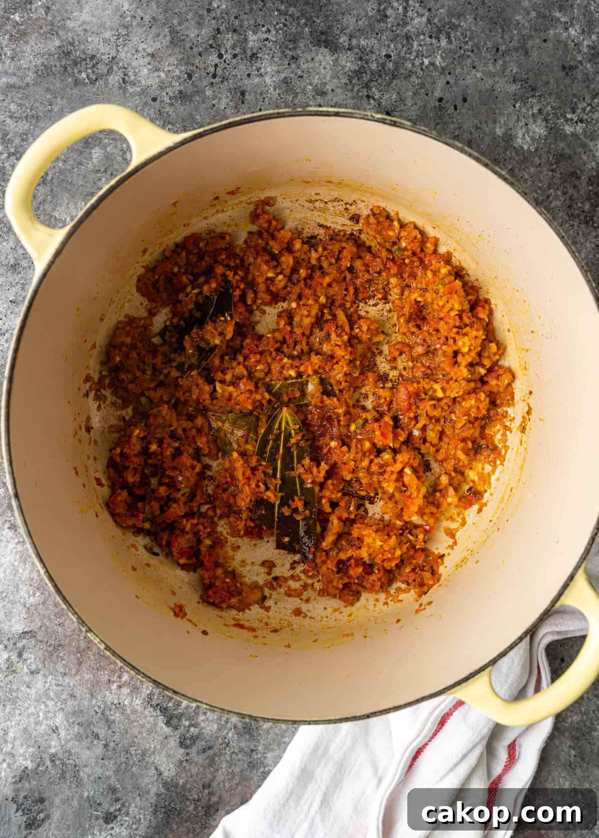 cooked down ingredients in pan for Aloo Gobi Matar