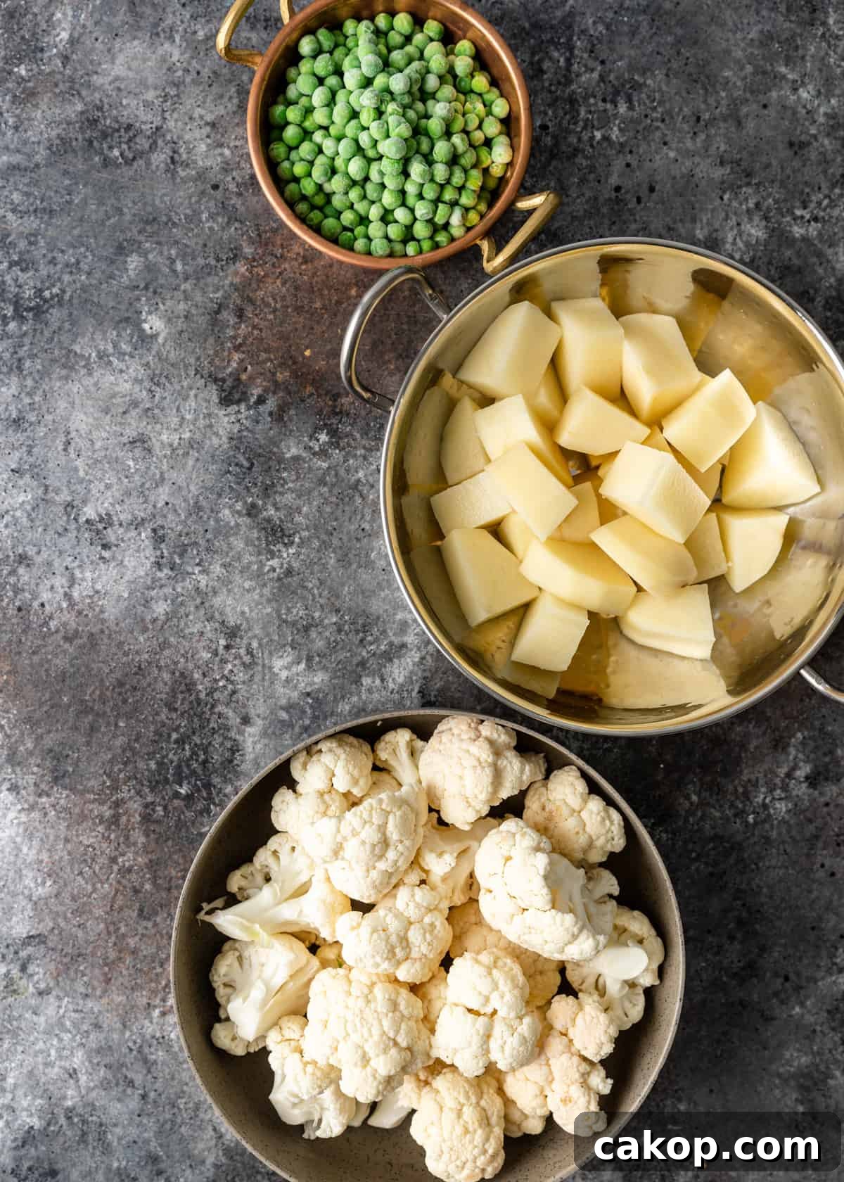 potatoes, cauliflower, and peas in bowls