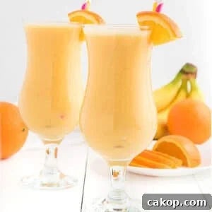 Creamy Orange Smoothie Recipe for Fresh, Zesty Mornings 8 Two glasses of orange smoothie side by side.