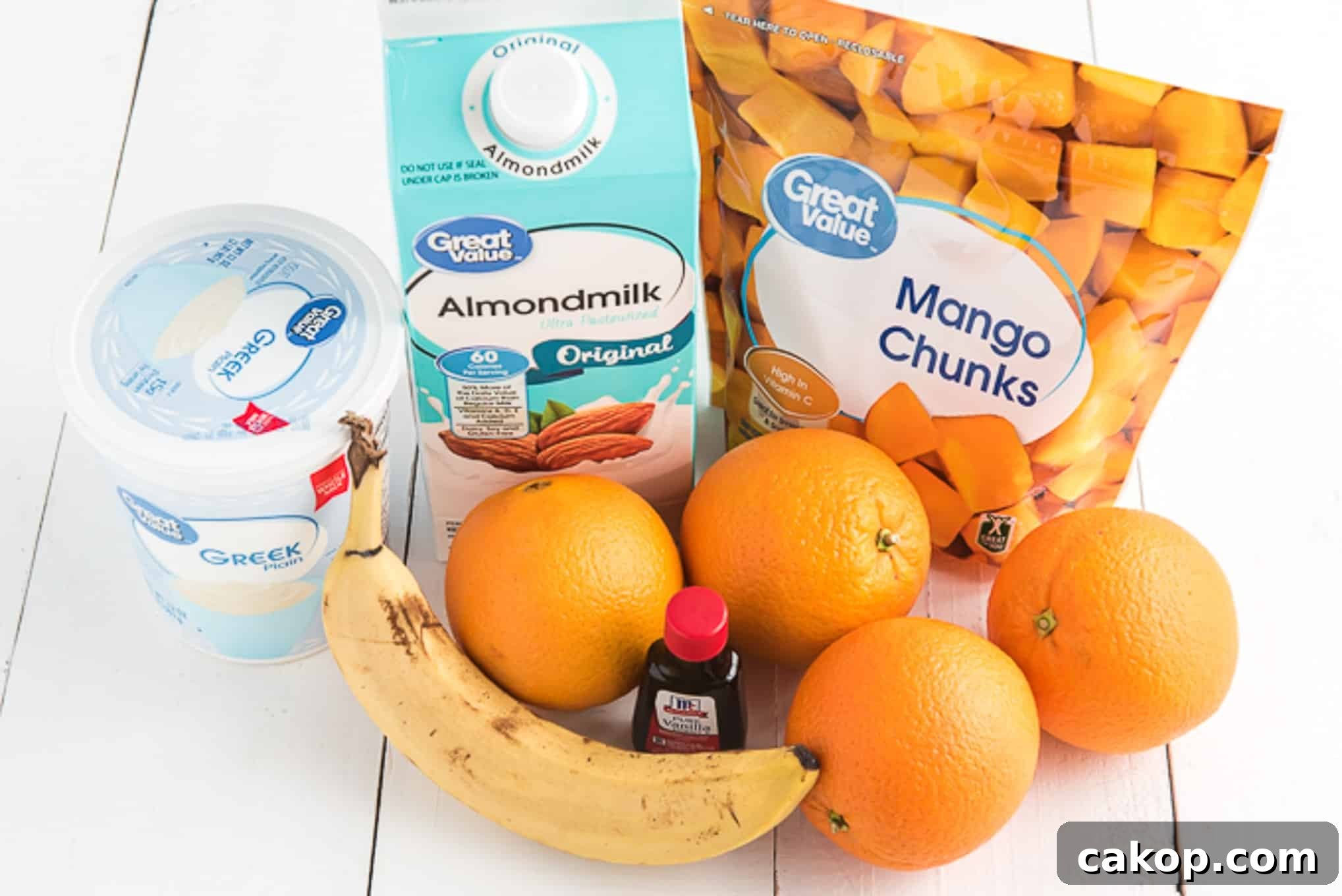 Creamy Orange Smoothie Recipe for Fresh, Zesty Mornings 3 Ingredients gathered together for orange smoothie.