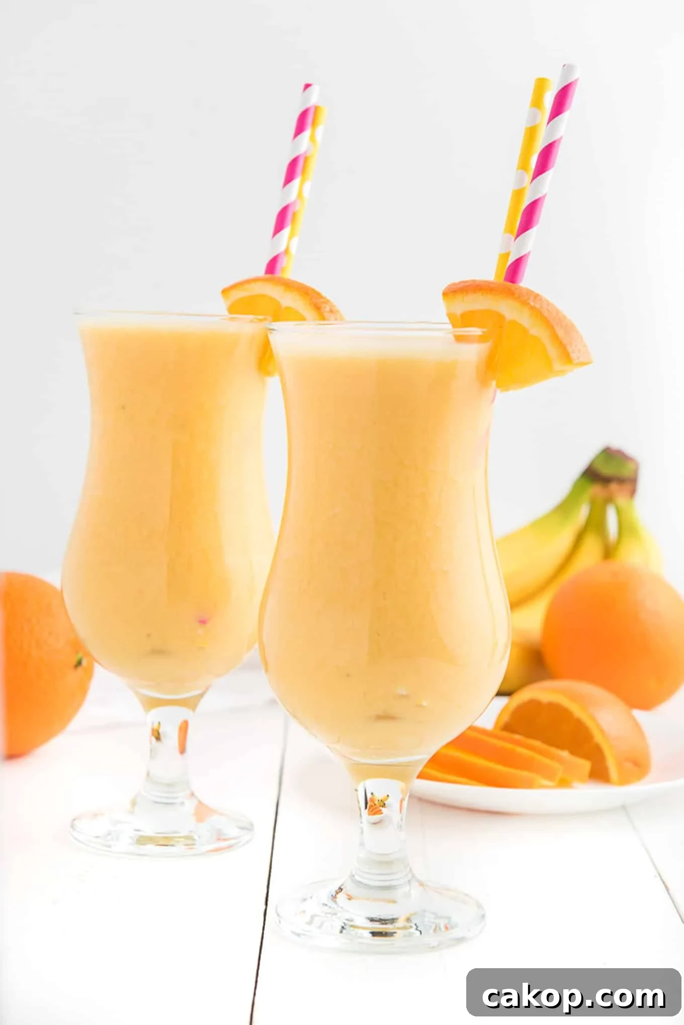 Creamy Orange Smoothie Recipe for Fresh, Zesty Mornings 6 Two glasses of orange smoothie side by side.