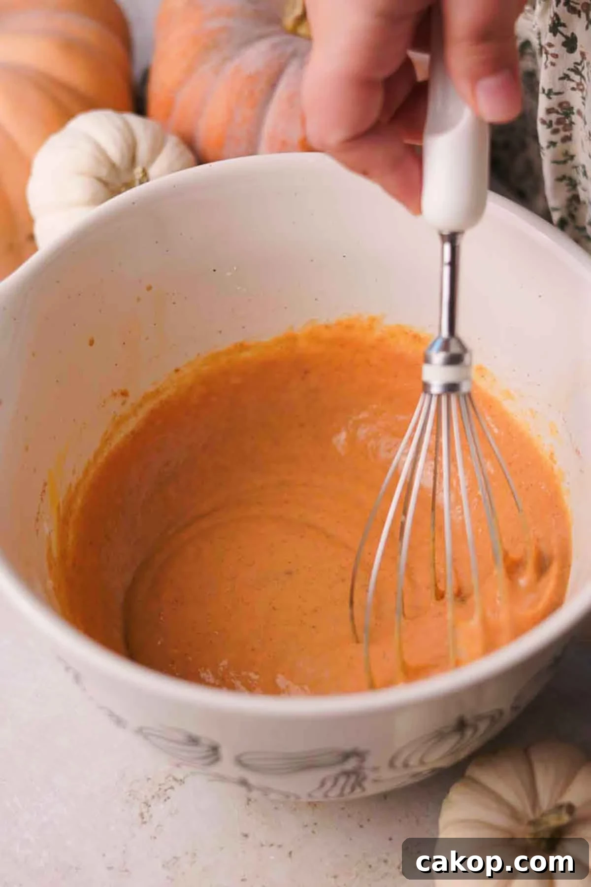 Creamy Pumpkin Pie Bars with Gingersnap Crust 11 whisking filling ingredients