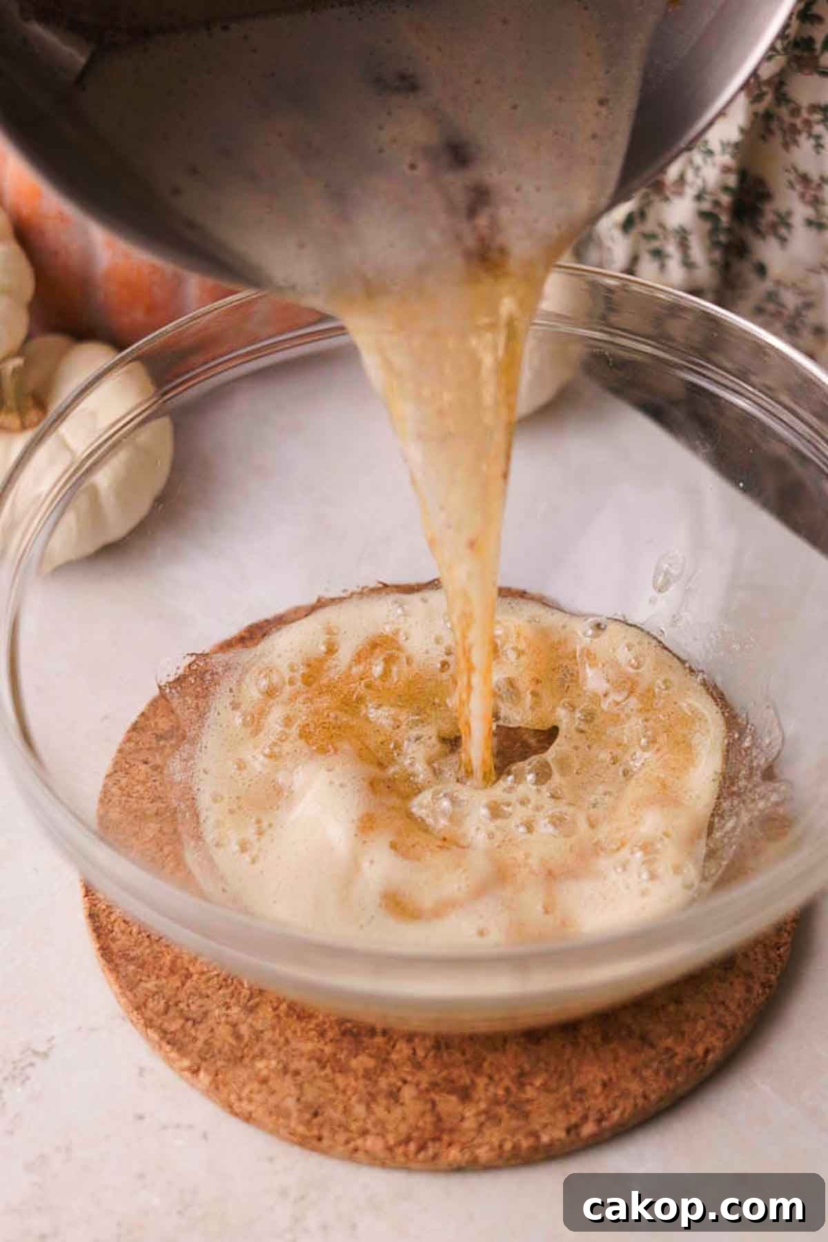 Creamy Pumpkin Pie Bars with Gingersnap Crust 6 pouring browned butter into bowl
