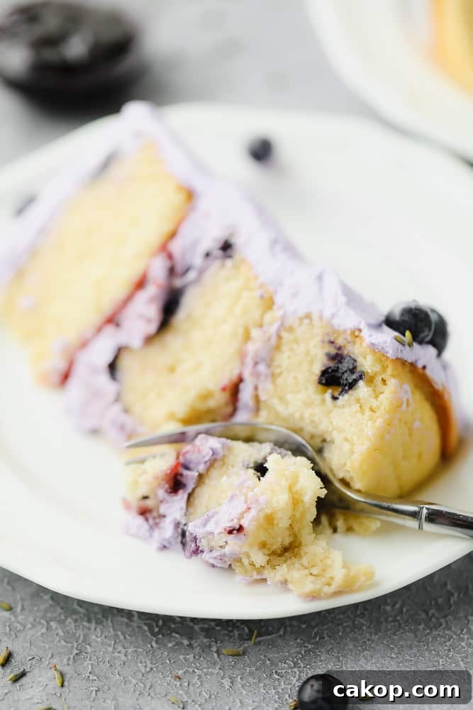 fork cutting into piece of cake