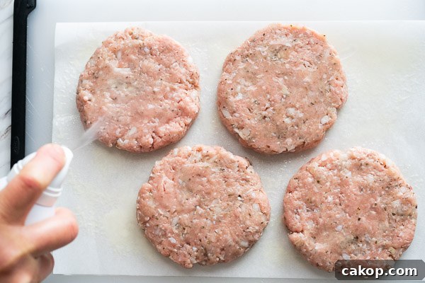 Turkey meat formed into 4 patties and sprayed with oil