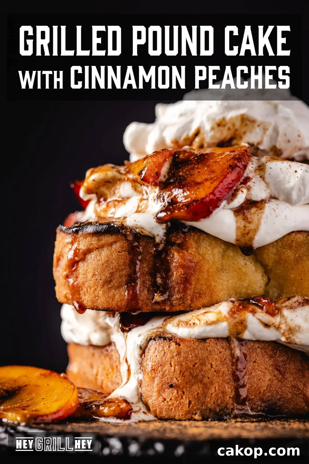 Grilled Pound Cake with Cinnamon-Smeared Peaches 2 Pound cake with cream and peaches on a black plate. The text overlay reads "Grilled Pound Cake with Cinnamon Peaches" at the top, and "Hey Grill Hey" at the bottom.