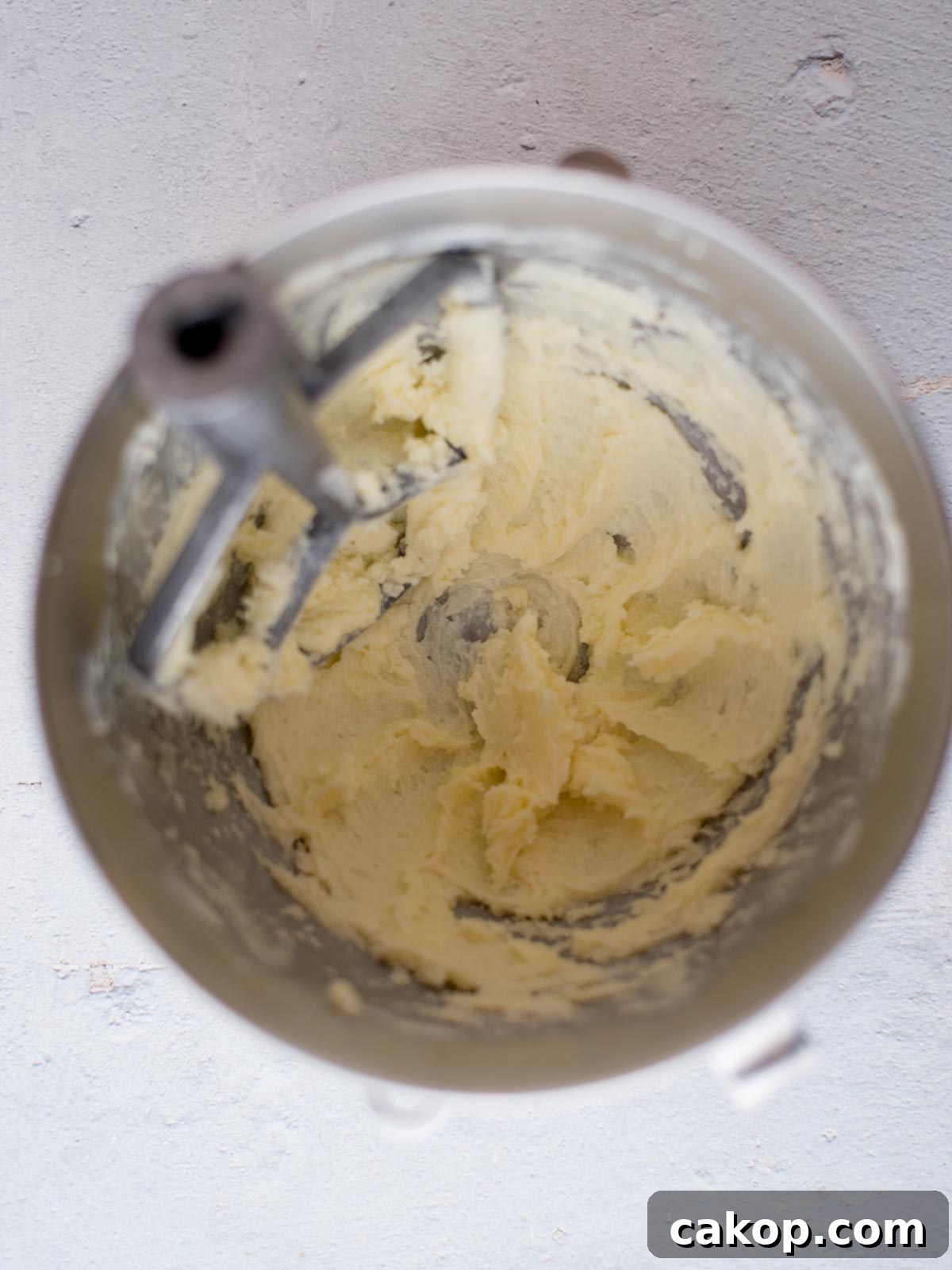 butter and sugar creamed together in a mixing bowl