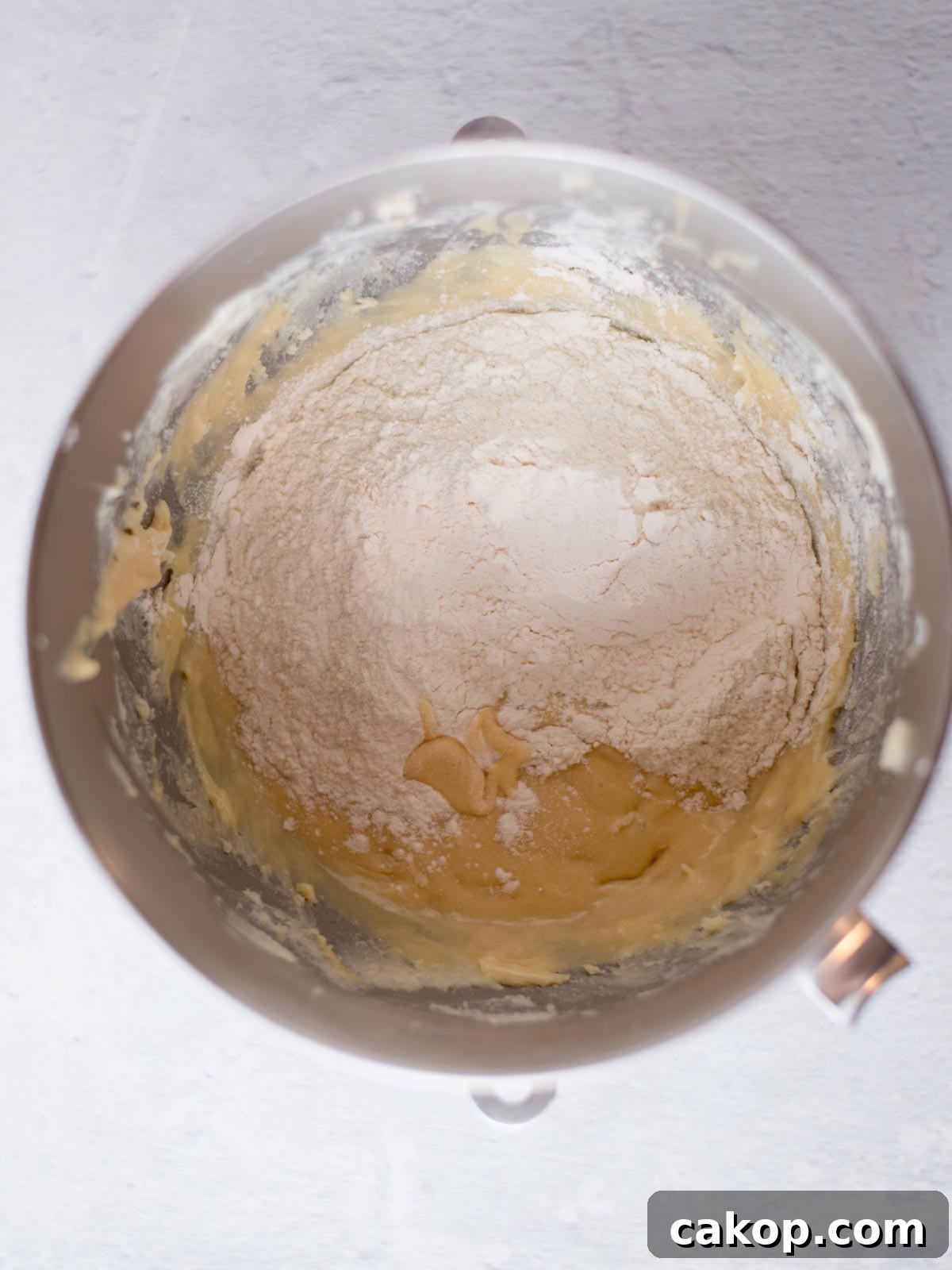 flour added to the dough in a mixing bowl