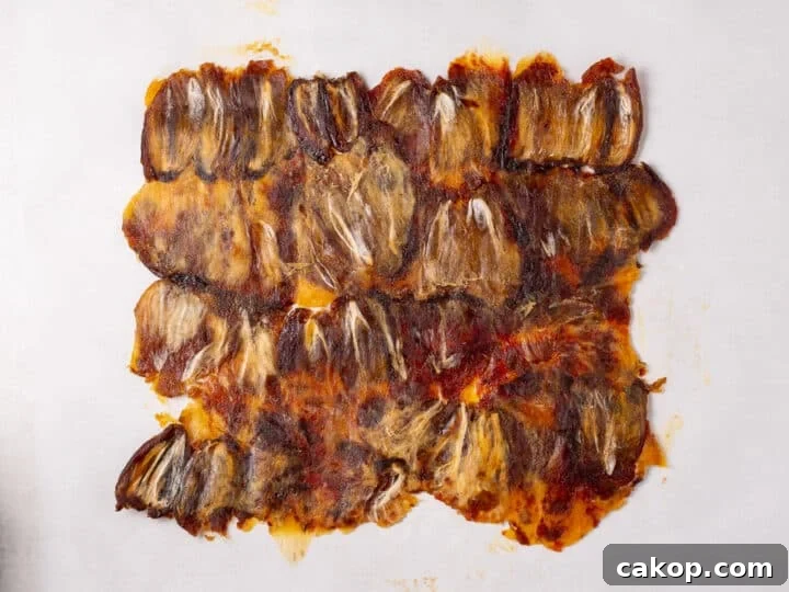 High-Protein Snickers Date Bark Recipe for Satisfying Snacks 9 Flattened dates pressed together into one even layer on parchment paper