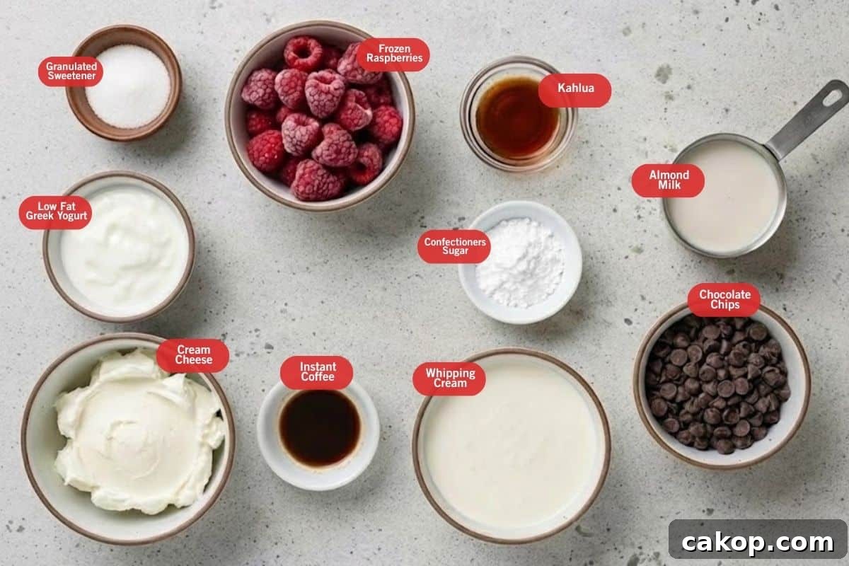 Flat lay photo of ingredient shot for  creamy Kahlua raspberry parfait
( granulated sweetener, frozen raspberries, kahlua, almond milk, chocolate chips, confectioners sugar, whipping cream, instant coffee mix with water, cream cheese, low fat greek yogurt)
