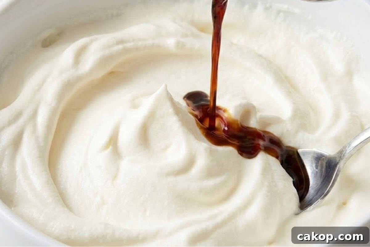 Beat the cream and sugar until soft peaks form and the mixture feels light. Stir in the Kahlua in a bowl.