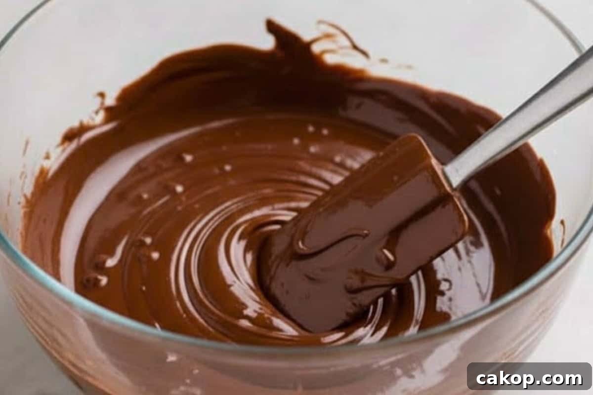 Microwave the chocolate chips in 30 second intervals, stirring after each round until fully melted.