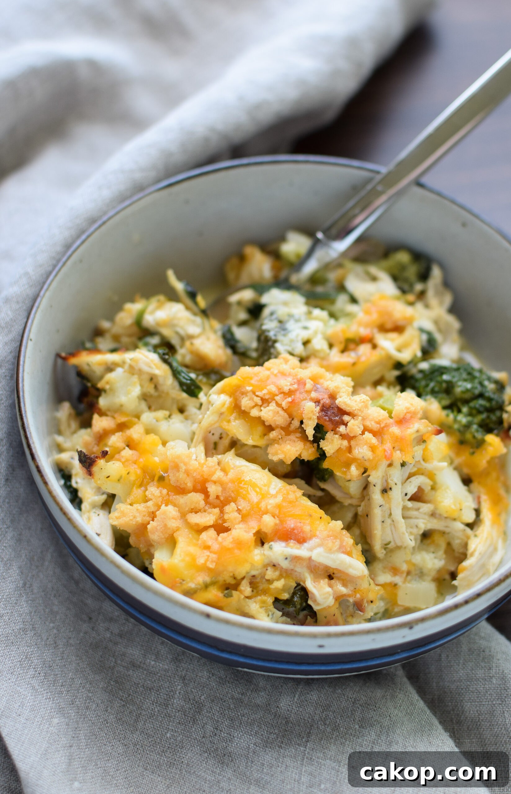 A bowl of Veggie Loaded Rotisserie Chicken Casserole.