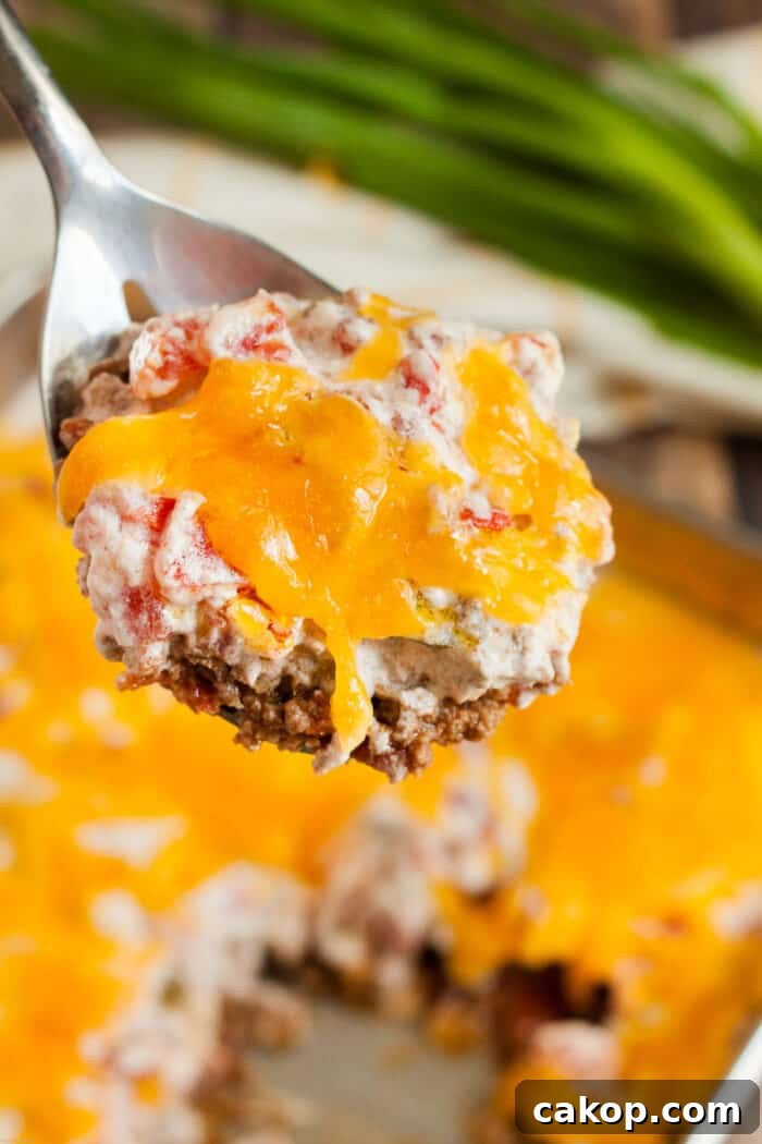 keto casserole beef and tomato on spoon being served