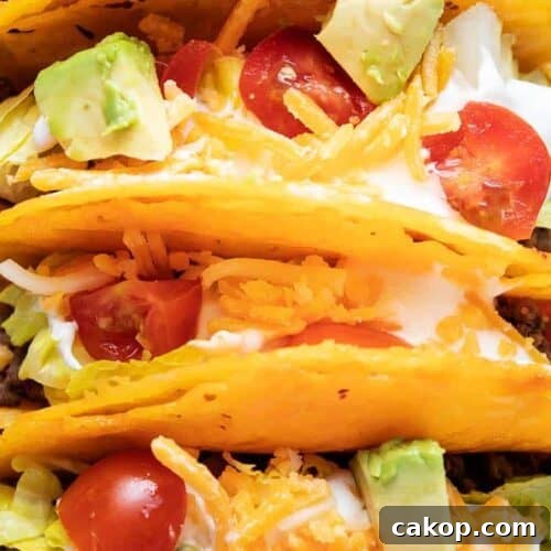 overhead closeup view of keto cheese taco shells filled with taco ingredients