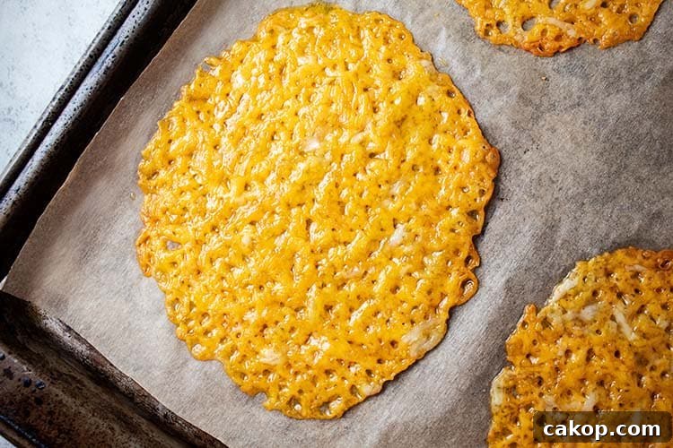 closeup view of keto cheese taco shells on baking sheet