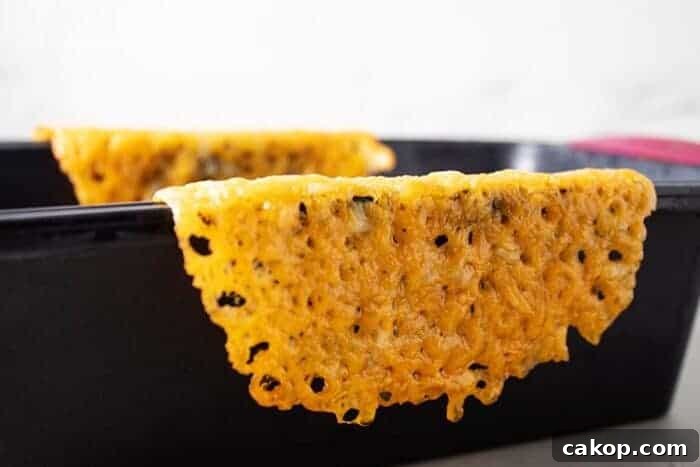 keto cheese shell draped over the side of a loaf pan