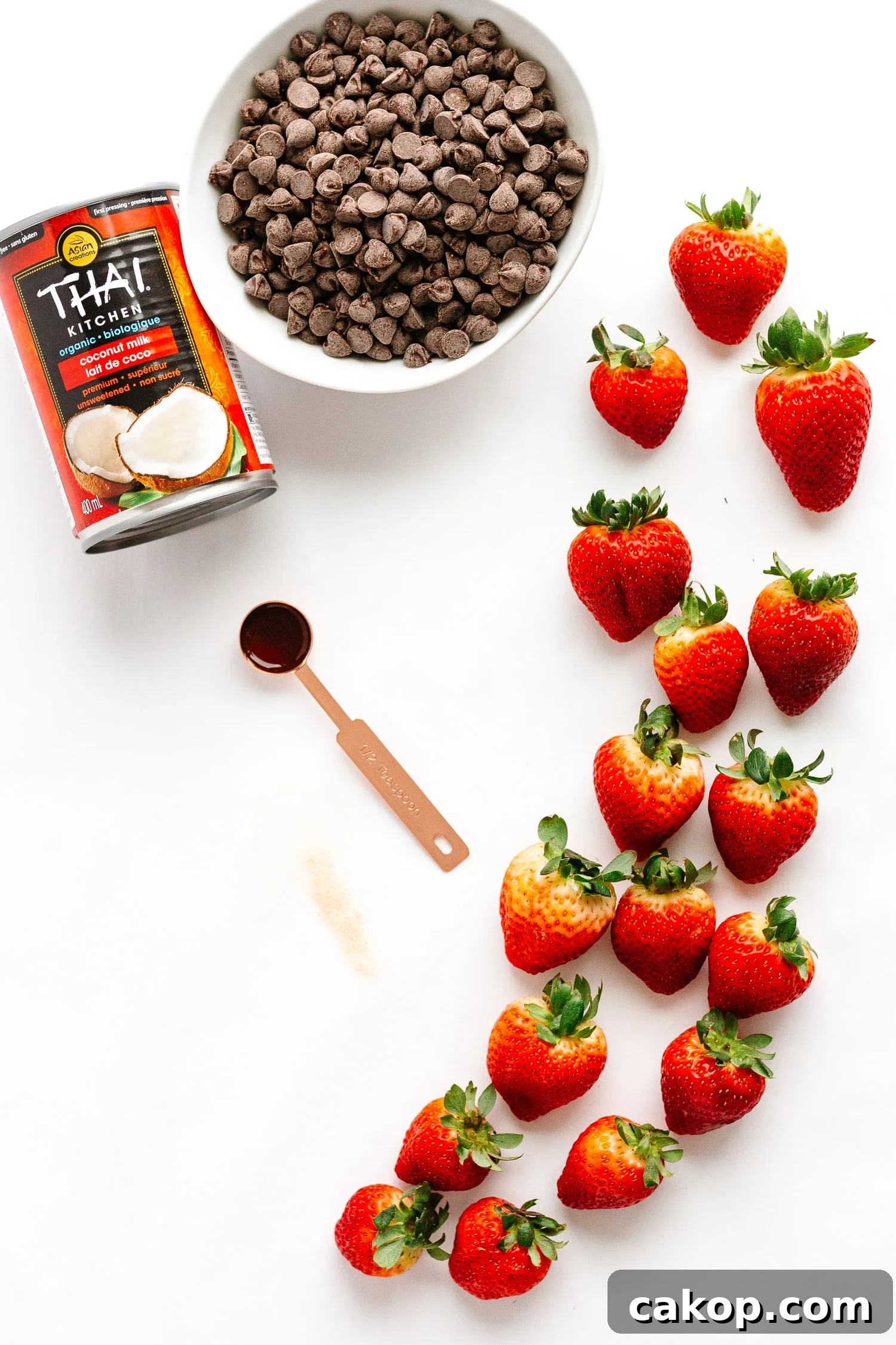 Flatlay showing ingredients needed to make chocolate coconut cream stuffed strawberries.