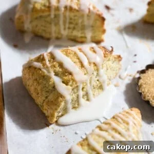 Sourdough Lemon Poppy Seed Scones Recipe for Tender, Tangy Bakes 17 Sourdough Discard Lemon Poppy Seed Scones on white parchment paper.