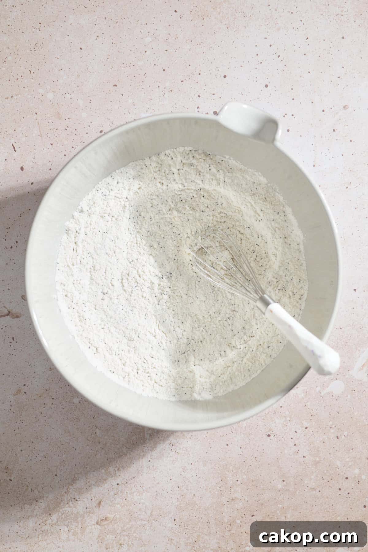 Sourdough Lemon Poppy Seed Scones Recipe for Tender, Tangy Bakes 5 Dry ingredients in a large mixing bowl.