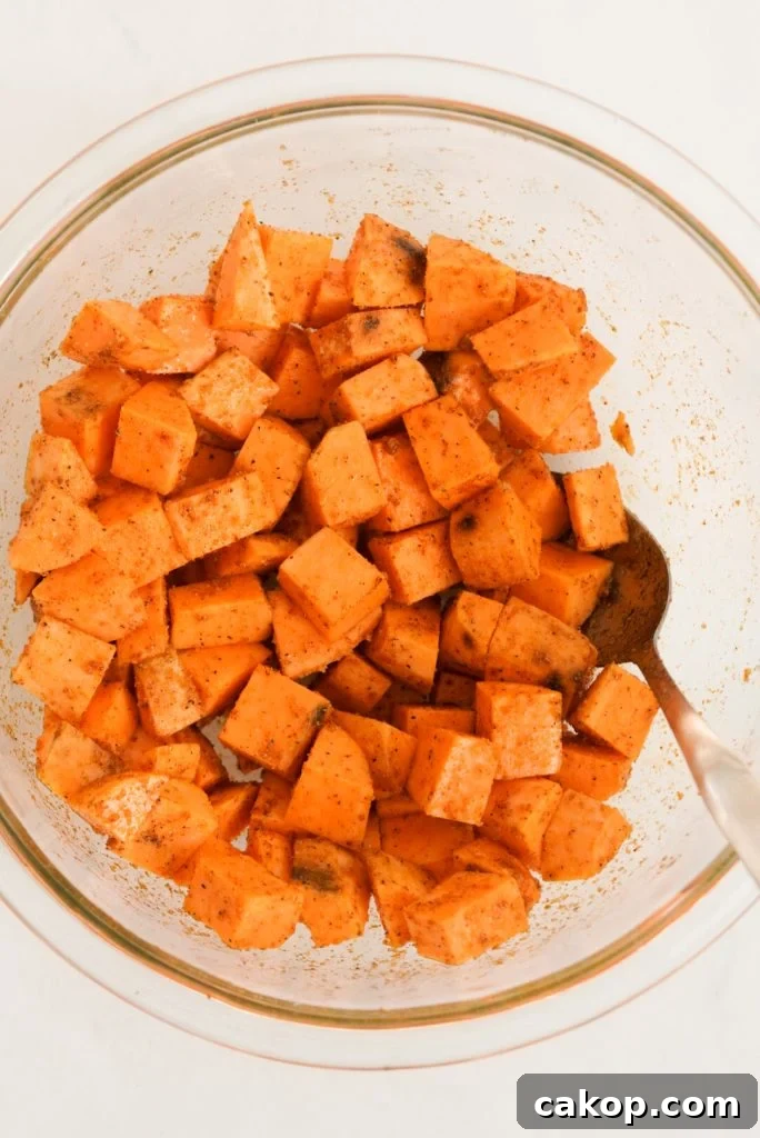 sweet potato chunks mixed with oil and seasonings