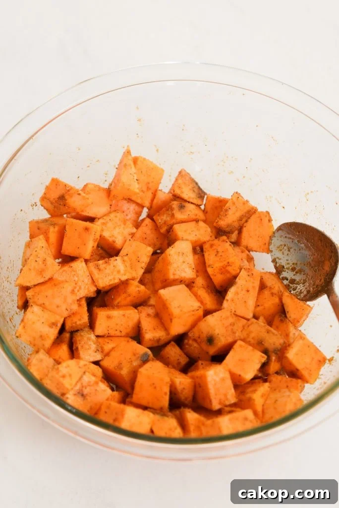 sweet potato cubes mixed with oil and seasonings