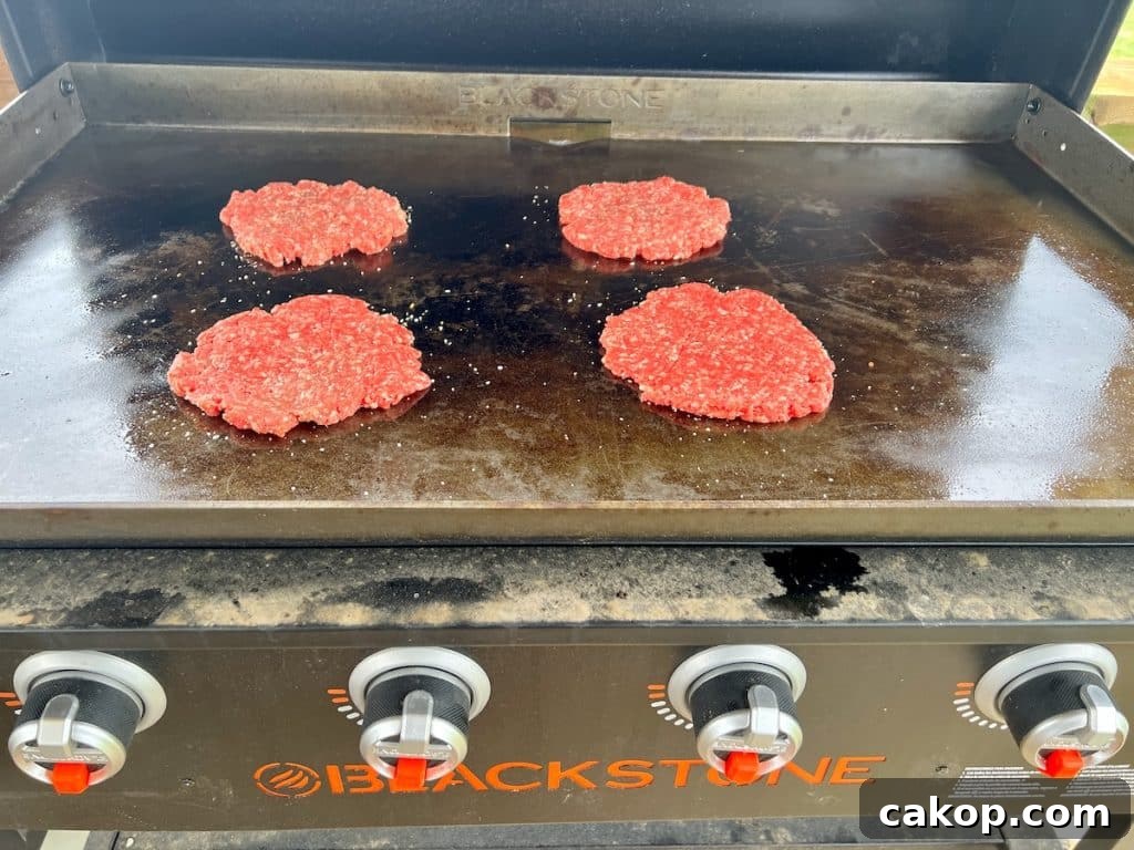 Guacamole Burger Recipe: Juicy Beef Patties with Fresh Avocado 2 4 burger patties on blackstone griddle.