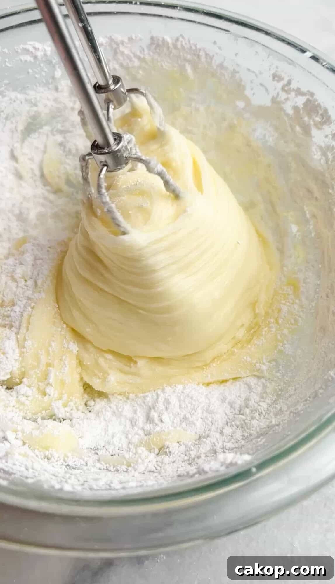 Strawberry Cheesecake Turnover Recipe — Flaky Pastry with Creamy Filling 5 cheesecake filling being whipped by hand