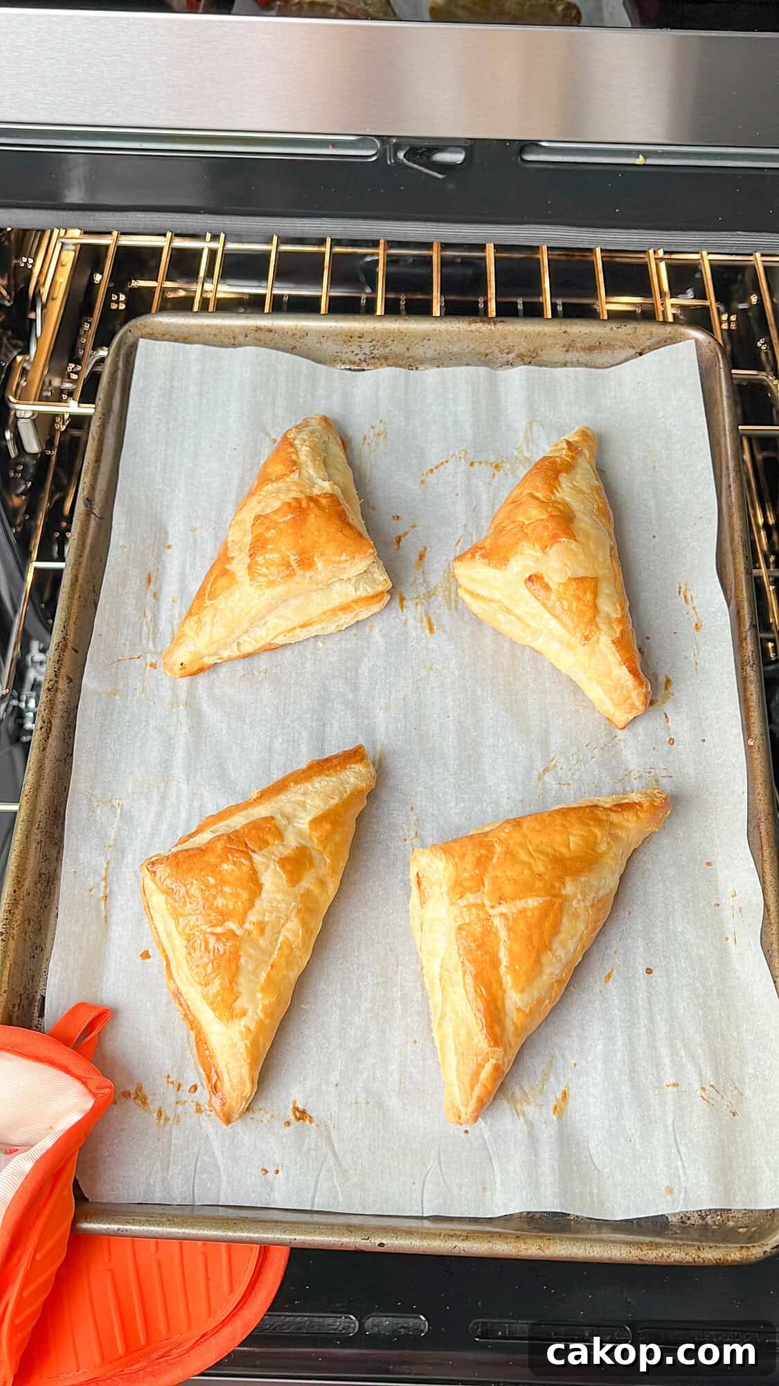 Strawberry Cheesecake Turnover Recipe — Flaky Pastry with Creamy Filling 9 puff pastry triangles on pan