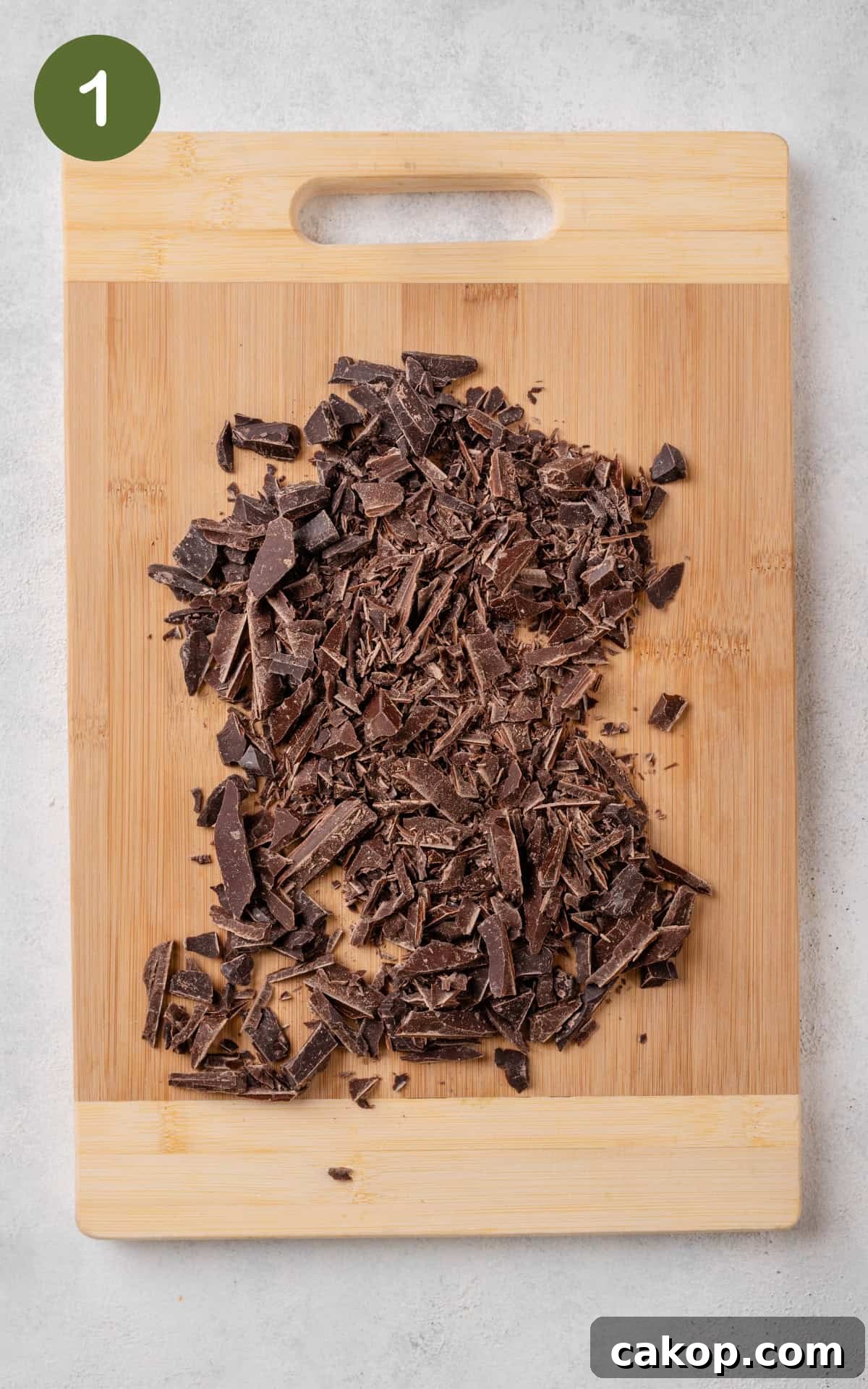 chopped dark chocolate on a cutting board.