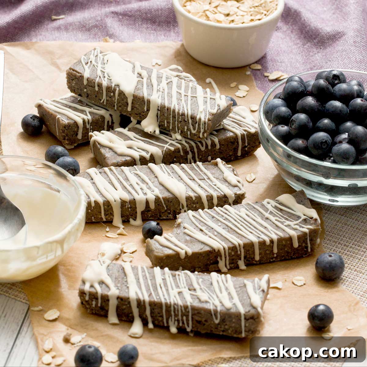 Creamy Sweet Potato Chocolate Pudding with Cottage Cheese 12 Gluten-free blueberry protein bars with a white chocolate drizzle on top.