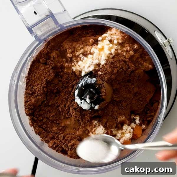 Creamy Sweet Potato Chocolate Pudding with Cottage Cheese 6 Adding sweet potato chocolate pudding ingredients in a food processor.