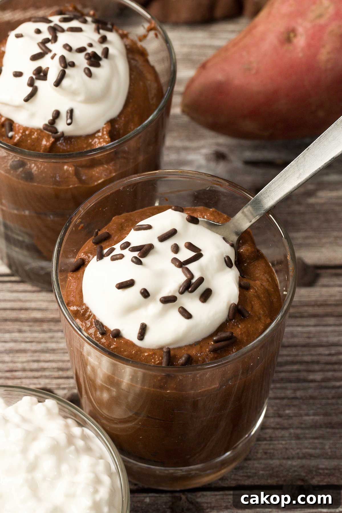 Creamy Sweet Potato Chocolate Pudding with Cottage Cheese 8 Close-up of a glass full of sweet potato chocolate pudding with cottage cheese and chocolate sprinkles on top.