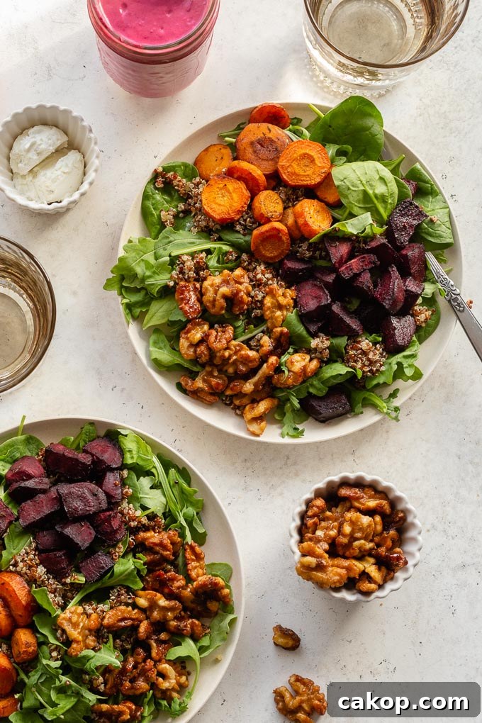 Beet salad assembled on plates with dressing and walnuts off to the sides.