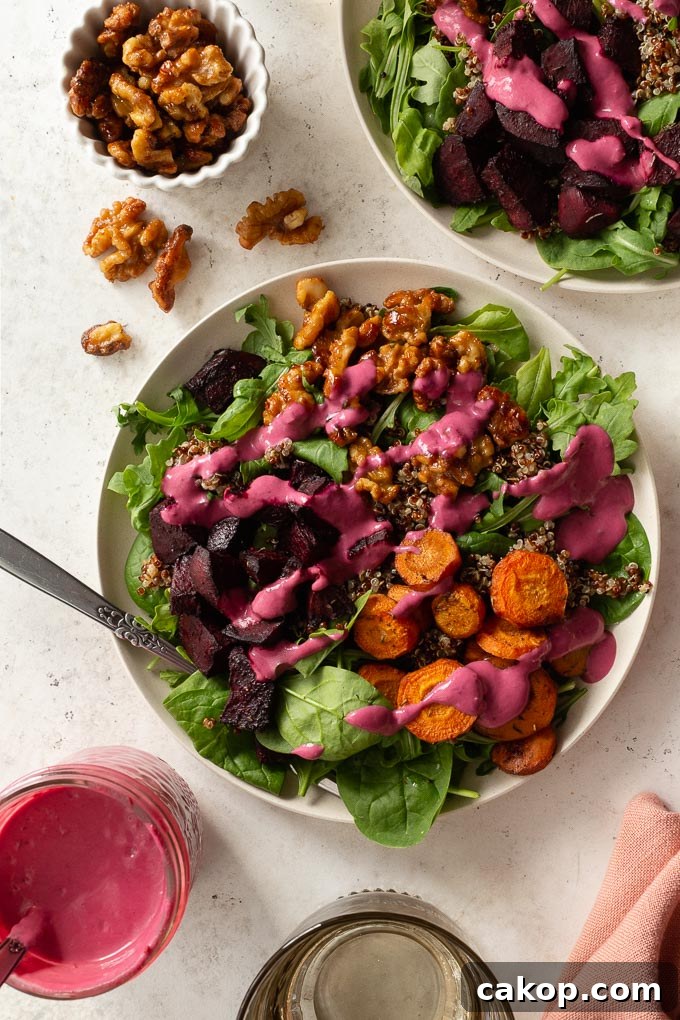 Up-close overhead view of roasted beet salad topped with cranberry salad dressing.