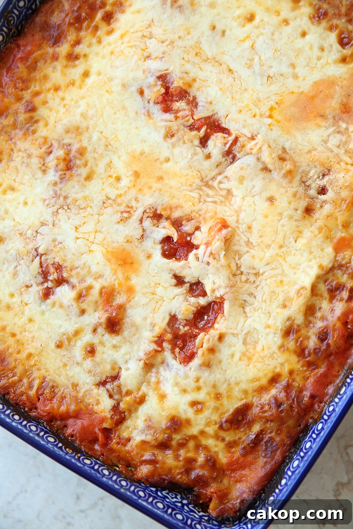 A large Polish pottery rectangle baking dish of roasted red pepper lasagna.